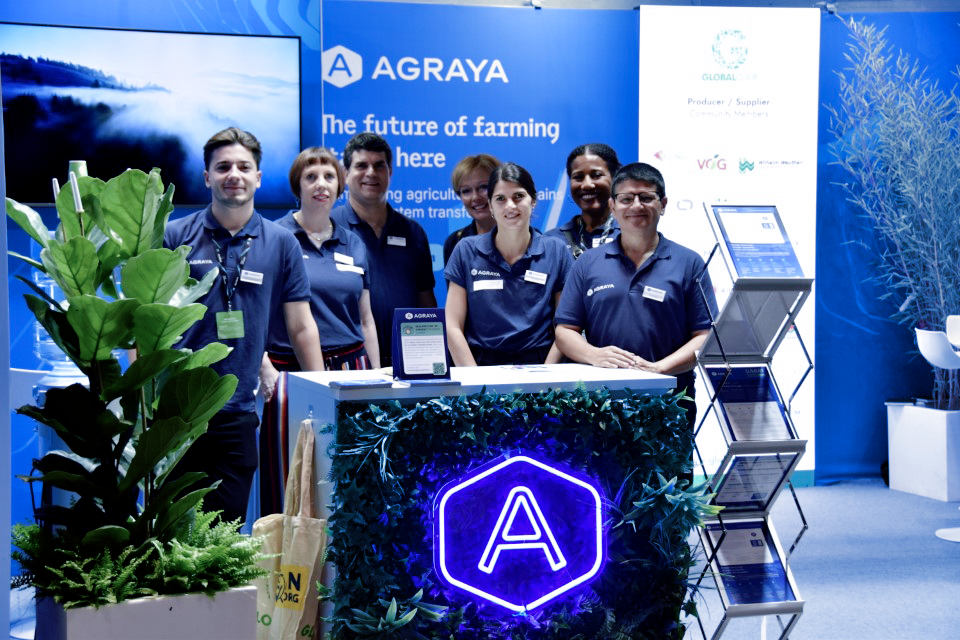 AGRAYA employees stand at the AGRAYA booth at Fruit Attraction 2025 in Madrid.
