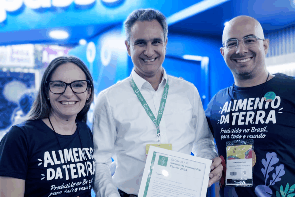 Trapview Group officials holding the GLOBALG.A.P. Community Membership Charter.