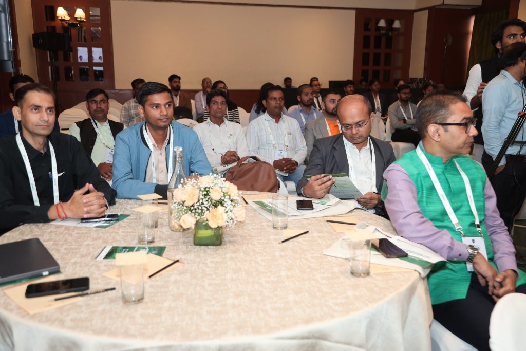 TOUR stop India participants sitting around a round table