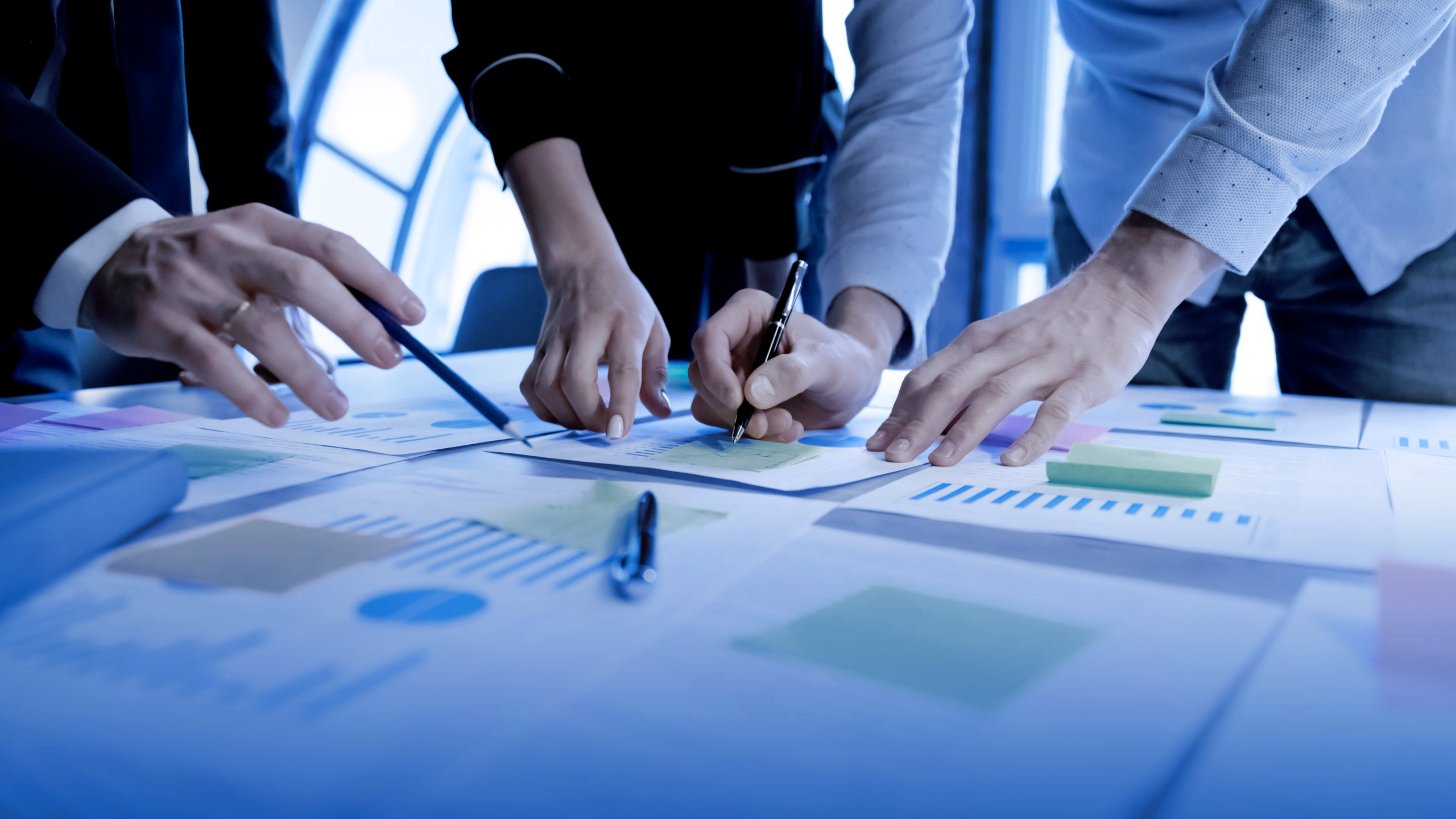 Image of stakeholders conducting a technical review of documents