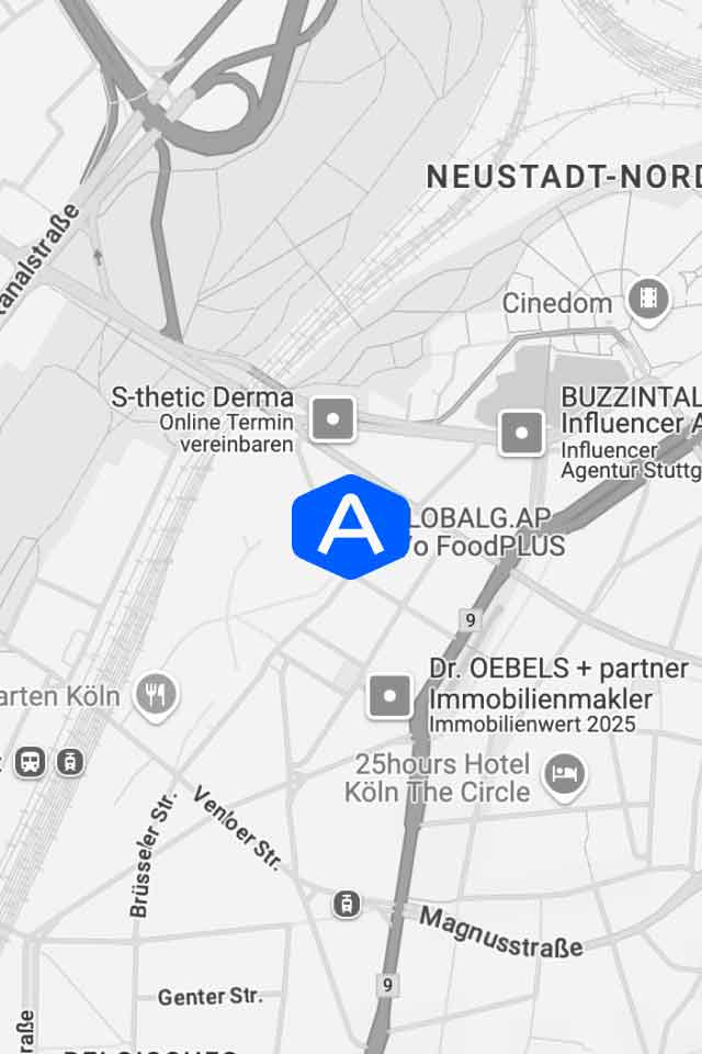 A grayscale map of a city area with streets and several locations labeled, including S-thetic Derma, BUZZTINAL, Dr. OEBELS + partner, and a blue hexagon with a white "A" in the center for easy contact reference.